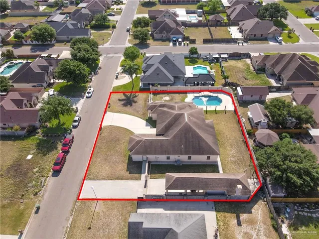 an aerial view of residential houses with outdoor space