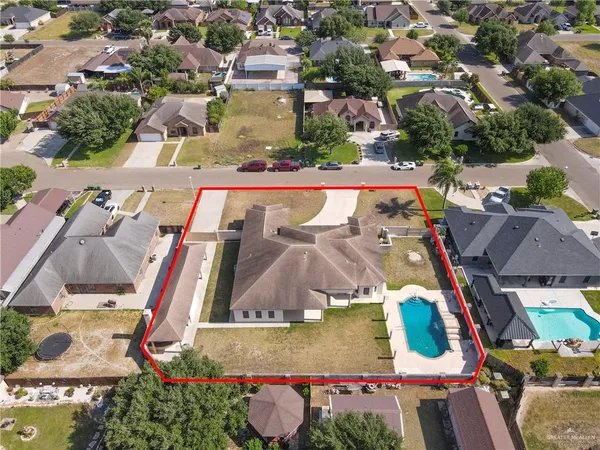 an aerial view of residential houses with outdoor space