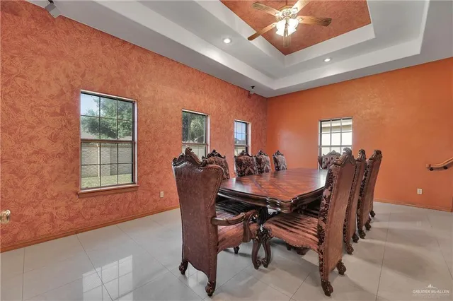 a dining room with furniture and window