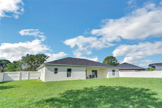 a front view of a house with yard