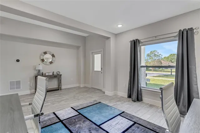 a living room with furniture and a window