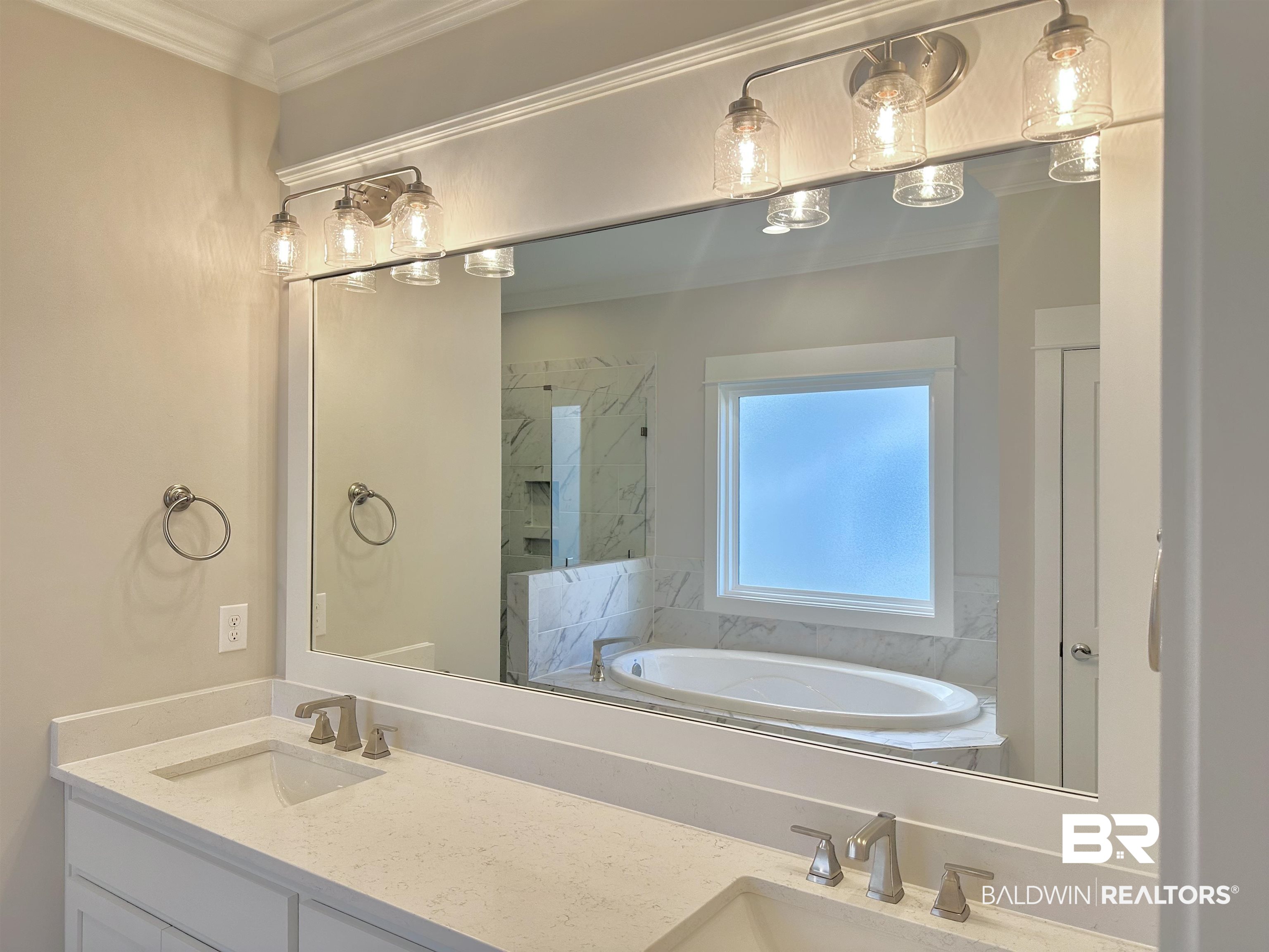 634 Kitfox Avenue Fairhope, AL 36532 - Photo 14 of 33 Bathroom with vanity, ornamental molding, and shower with separate bathtub