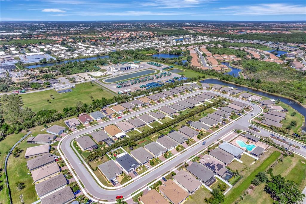 8997 Excelsior Loop Venice, FL 34293 - Photo 12 of 48 an aerial view of residential houses with outdoor space