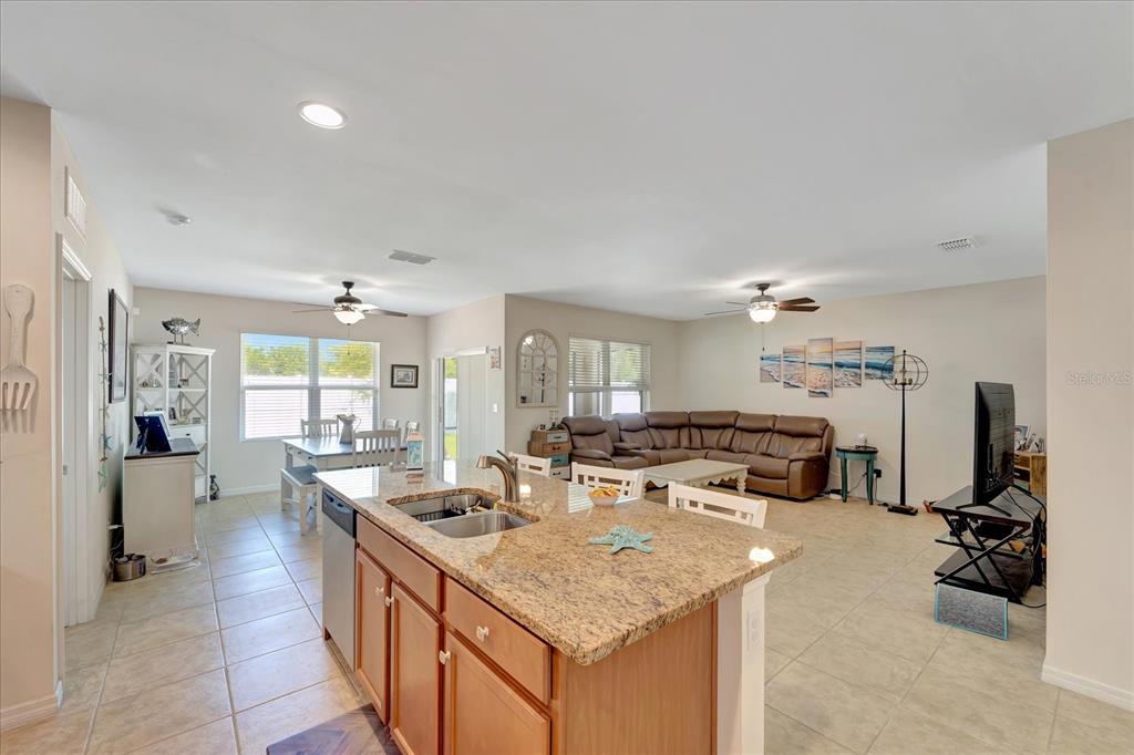8997 Excelsior Loop Venice, FL 34293 - Photo 23 of 48 a kitchen with sink stove and refrigerator