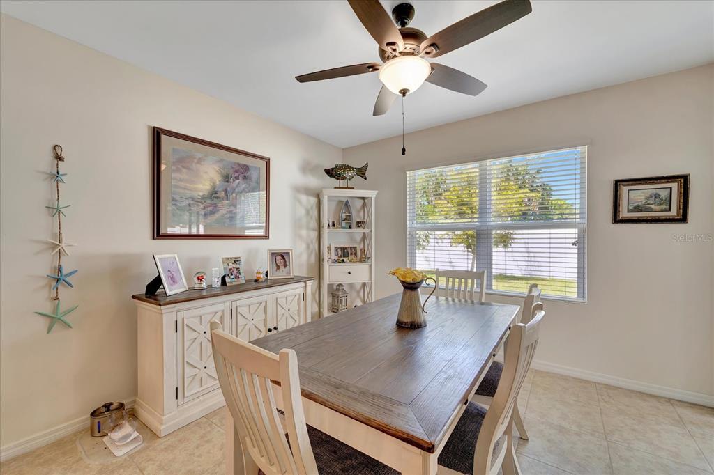 8997 Excelsior Loop Venice, FL 34293 - Photo 25 of 48 a view of a dining room with furniture window and outside view