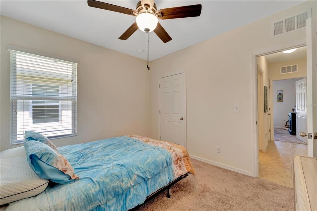8997 Excelsior Loop Venice, FL 34293 - Photo 29 of 48 a bedroom with a bed and a window