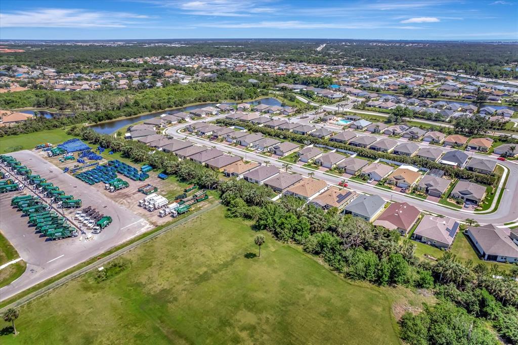 8997 Excelsior Loop Venice, FL 34293 - Photo 8 of 48 an aerial view of residential houses with outdoor space