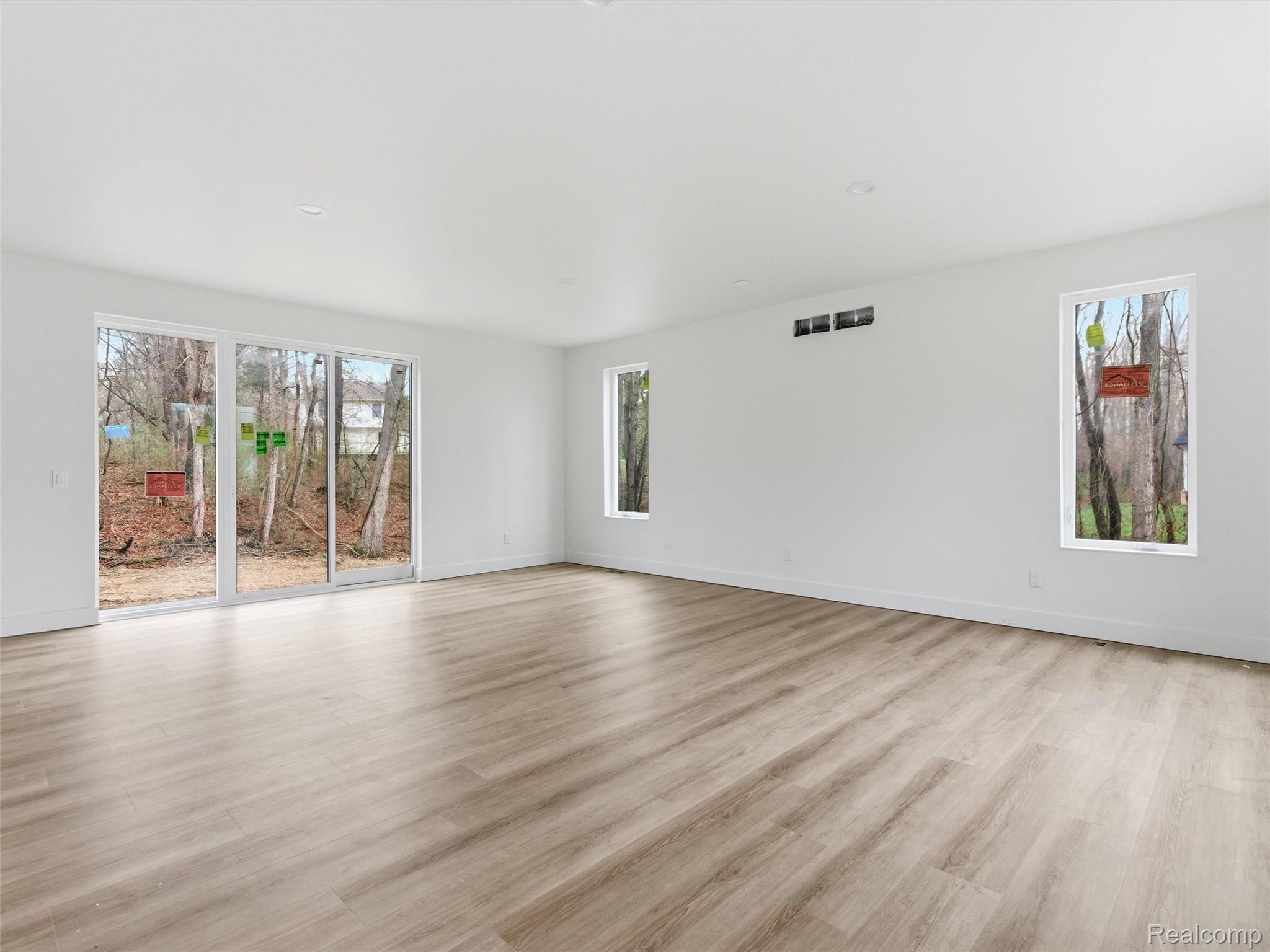 11810 Scenic Valley Road Davisburg, MI 48350 - Photo 6 of 46 Spare room featuring light wood-type flooring and baseboards