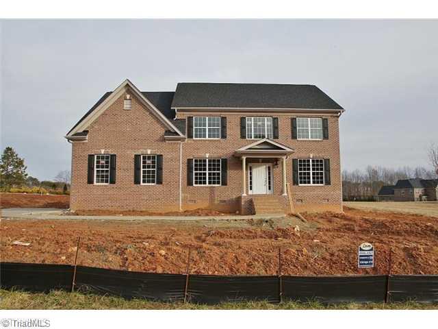 6622 Stonecroft Drive Oak Ridge, NC 27310 - Photo 1 of 6 Exterior Front. ALL BRICK, SIDE ENTRY GARAGE