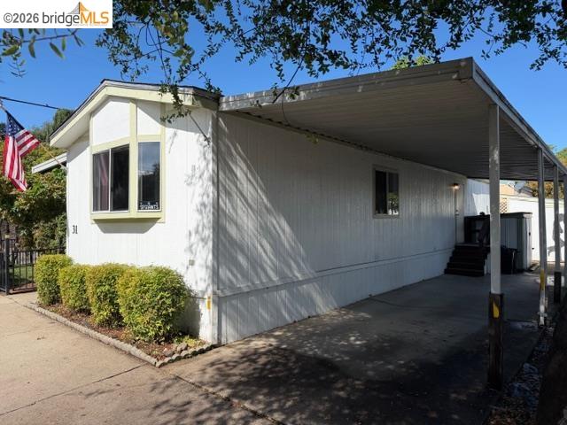 14192 Tuolumne Road, Unit 31 Sonora, CA 95370 - Photo 7 of 11 a view of a house with a garage