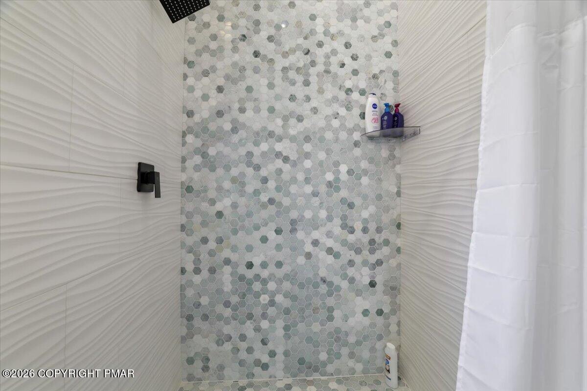 5873 Decker Road Bushkill, PA 18324 - Photo 13 of 57 a bathroom with a shower and a sink