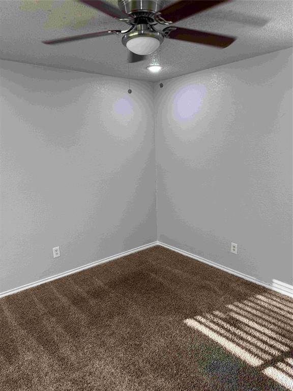 2959 Scott Mill Road Carrollton, TX 75007 - Photo 12 of 26 a view of an empty room and chandelier fan