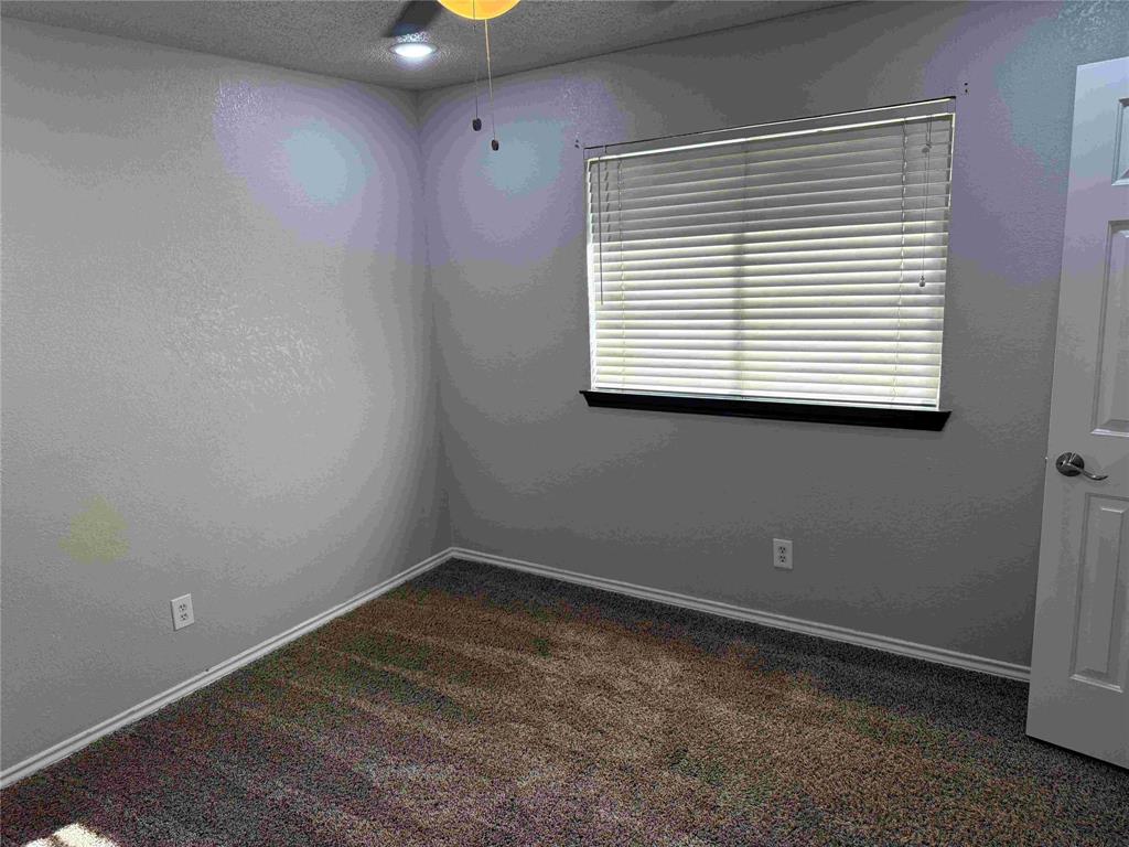 2959 Scott Mill Road Carrollton, TX 75007 - Photo 17 of 26 an empty room with a window