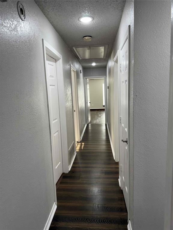 2959 Scott Mill Road Carrollton, TX 75007 - Photo 19 of 26 a view of a hallway with wooden floor
