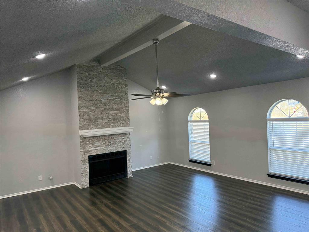 2959 Scott Mill Road Carrollton, TX 75007 - Photo 26 of 26 an empty room with stairs and a fireplace