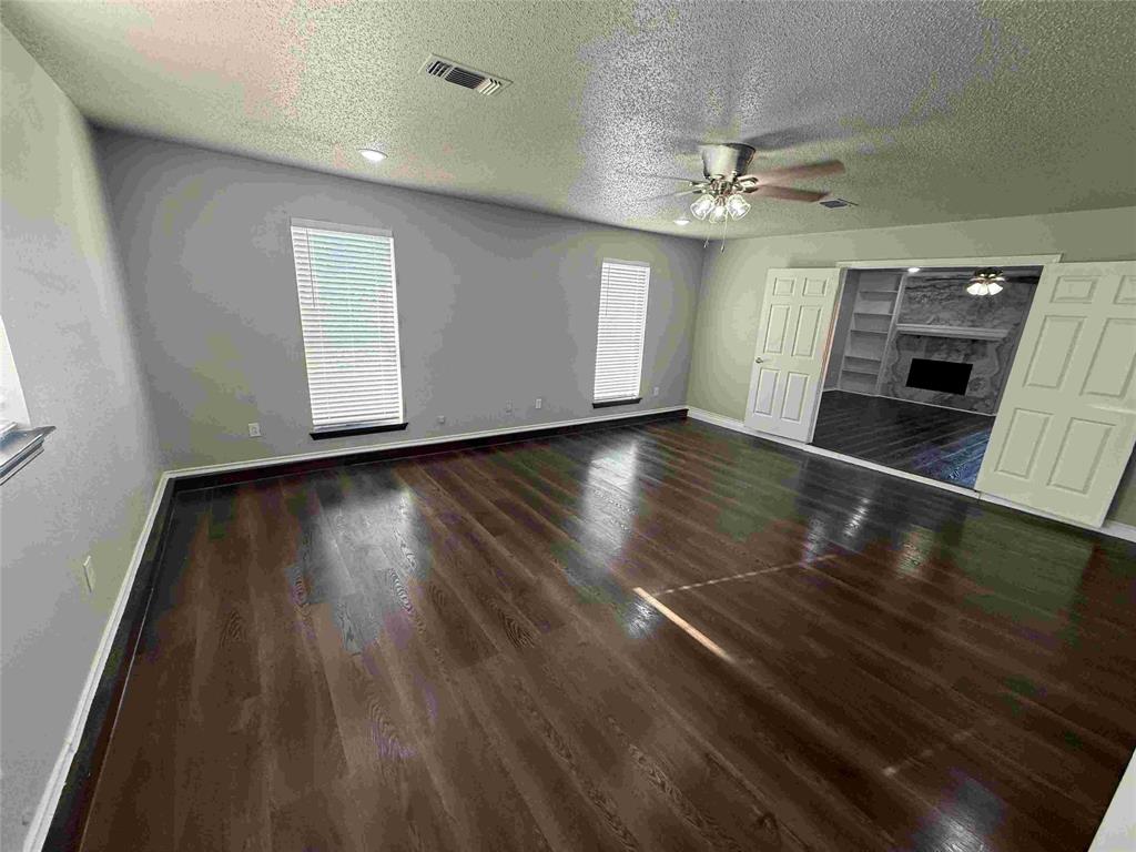 2959 Scott Mill Road Carrollton, TX 75007 - Photo 9 of 26 wooden floor in an empty room with a window