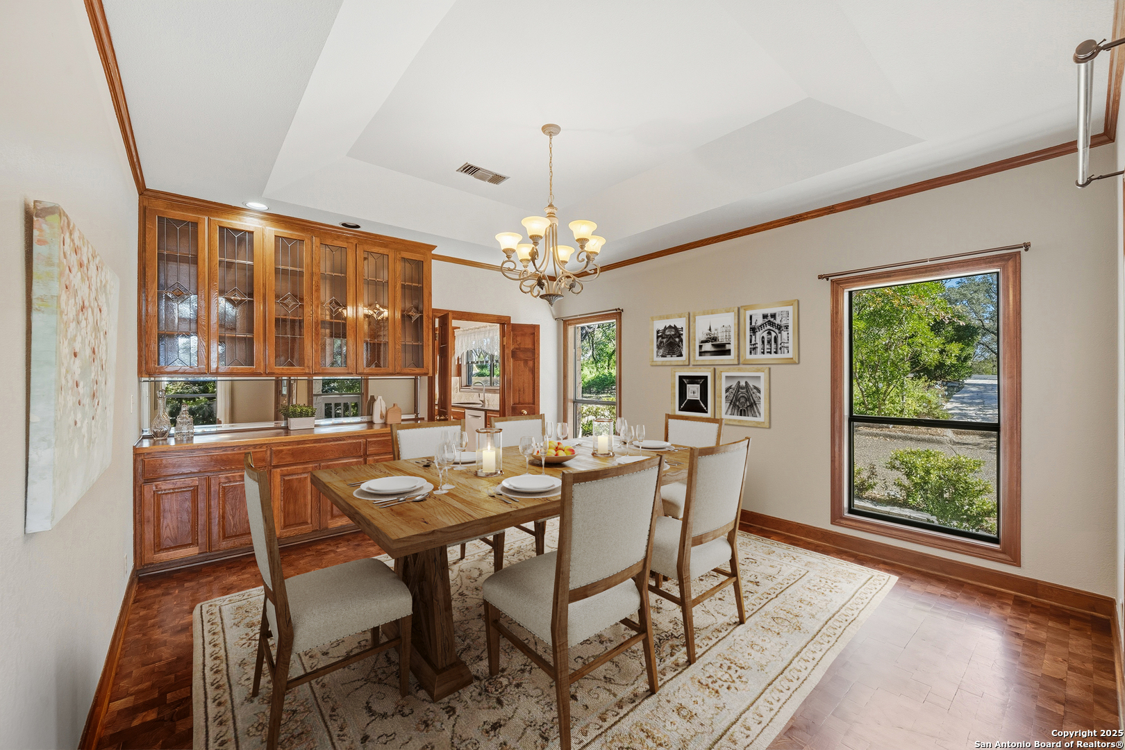 14819 Seven L Trail Helotes, TX 78023 - Photo 11 of 61 a view of a dining room with furniture wooden floor and chandelier