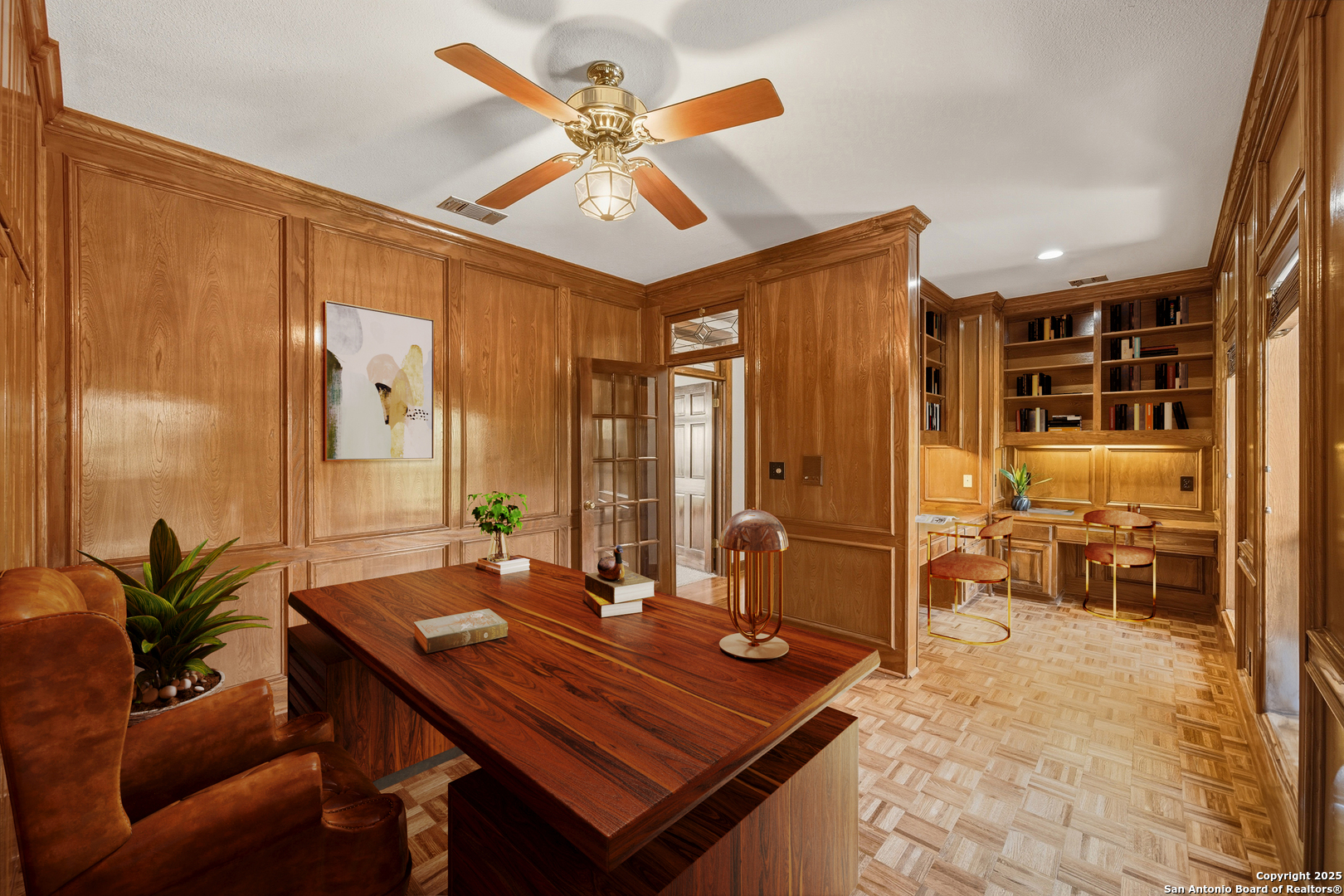 14819 Seven L Trail Helotes, TX 78023 - Photo 15 of 61 a living room with furniture a chandelier and a dining table
