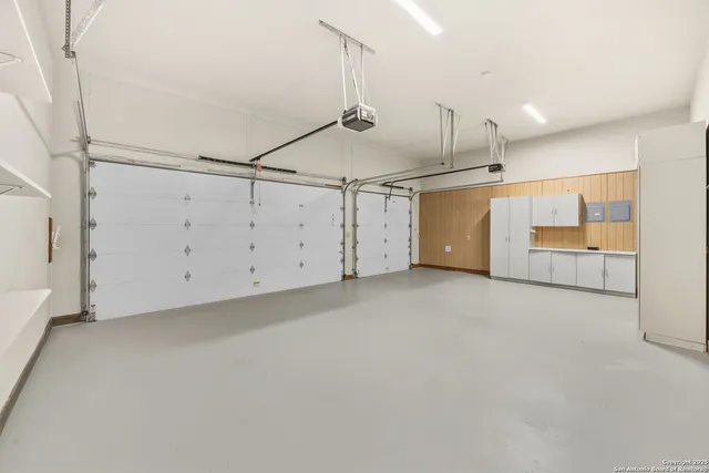 a kitchen with stainless steel appliances granite countertop a sink a stove and a microwave