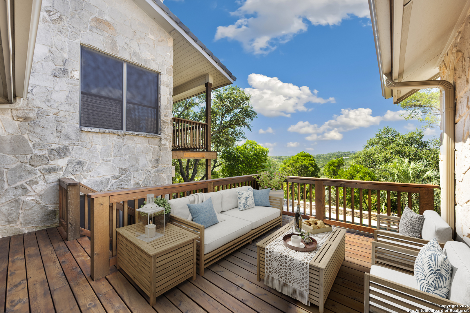 14819 Seven L Trail Helotes, TX 78023 - Photo 21 of 61 a balcony with furniture and wooden floor