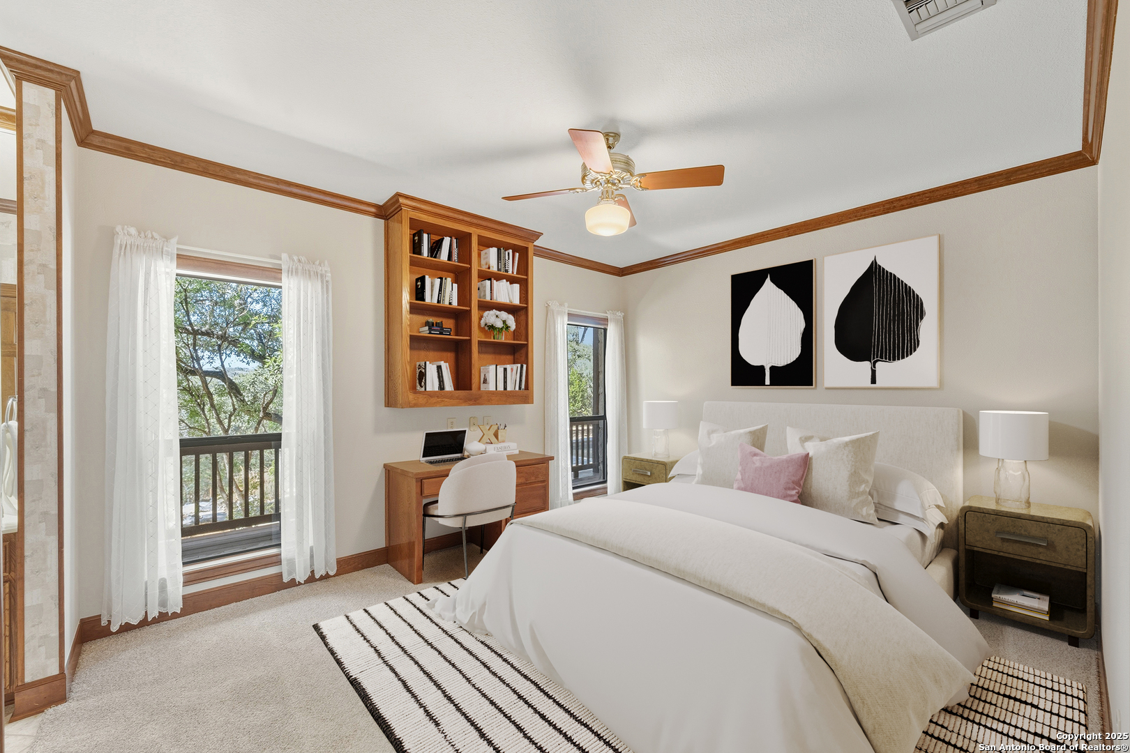 14819 Seven L Trail Helotes, TX 78023 - Photo 26 of 61 a bedroom with a bed and a chandelier