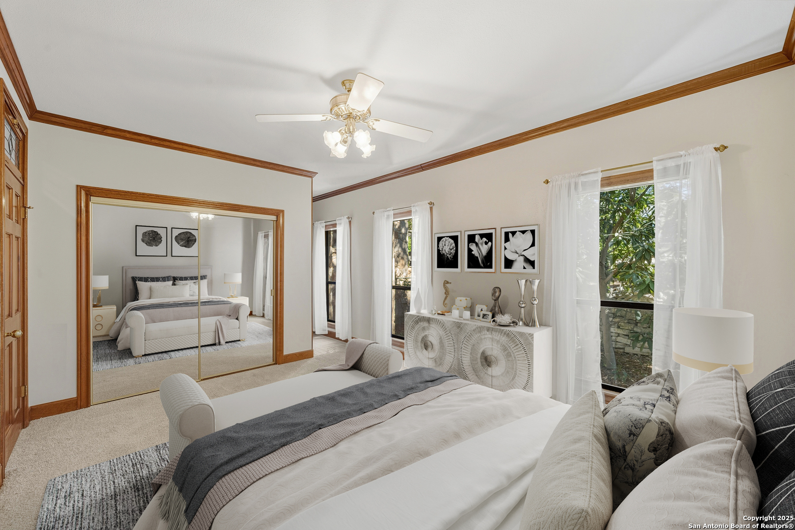 14819 Seven L Trail Helotes, TX 78023 - Photo 28 of 61 a bedroom with a bed and a large mirror with the outer view