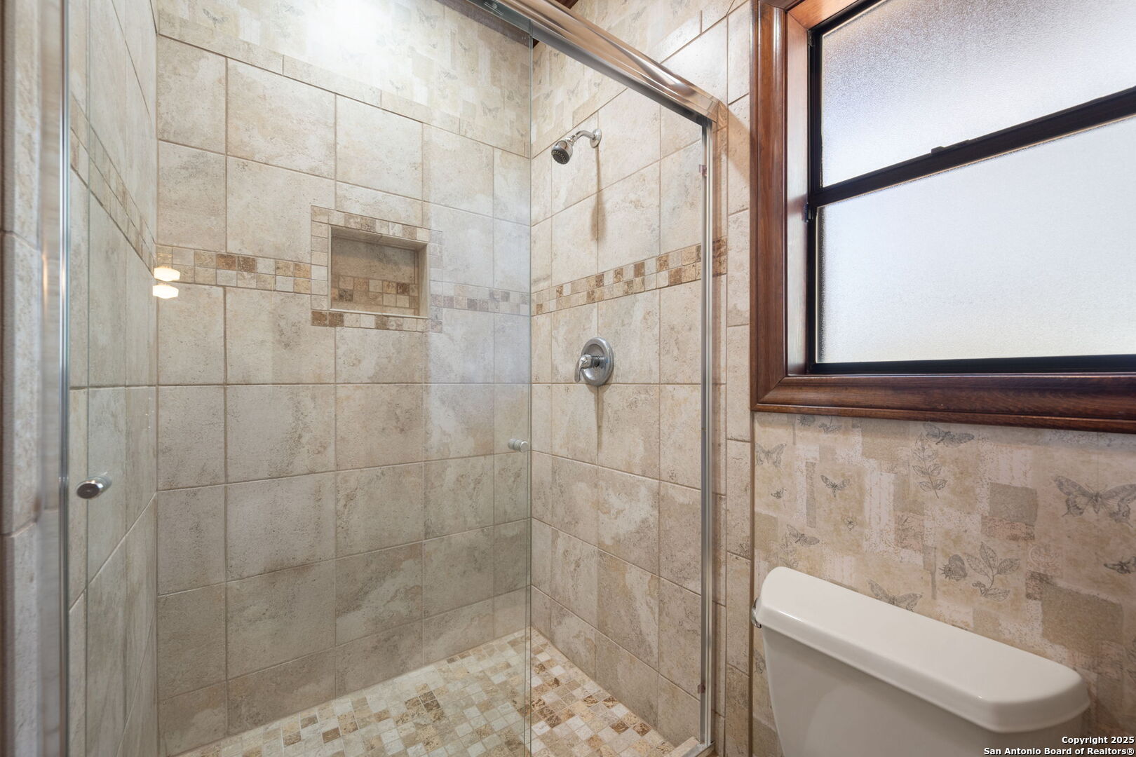 14819 Seven L Trail Helotes, TX 78023 - Photo 29 of 61 a bathroom with a shower and a toilet