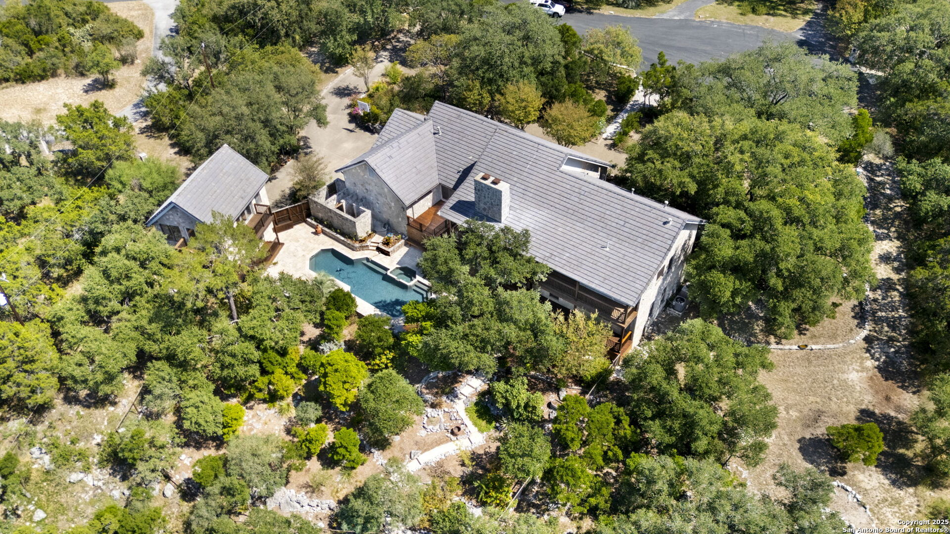 14819 Seven L Trail Helotes, TX 78023 - Photo 3 of 61 an aerial view of a house with a yard and outdoor space