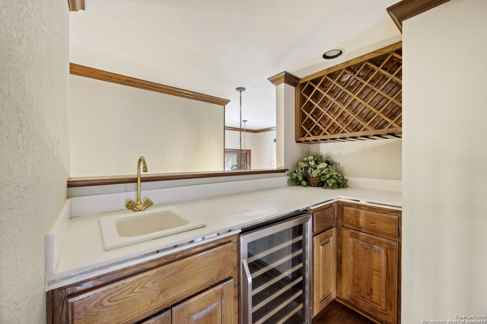 14819 Seven L Trail Helotes, TX 78023 - Photo 32 of 61 a kitchen with a sink and a mirror