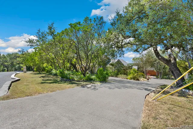 a bathroom with a sink mirror and toilet