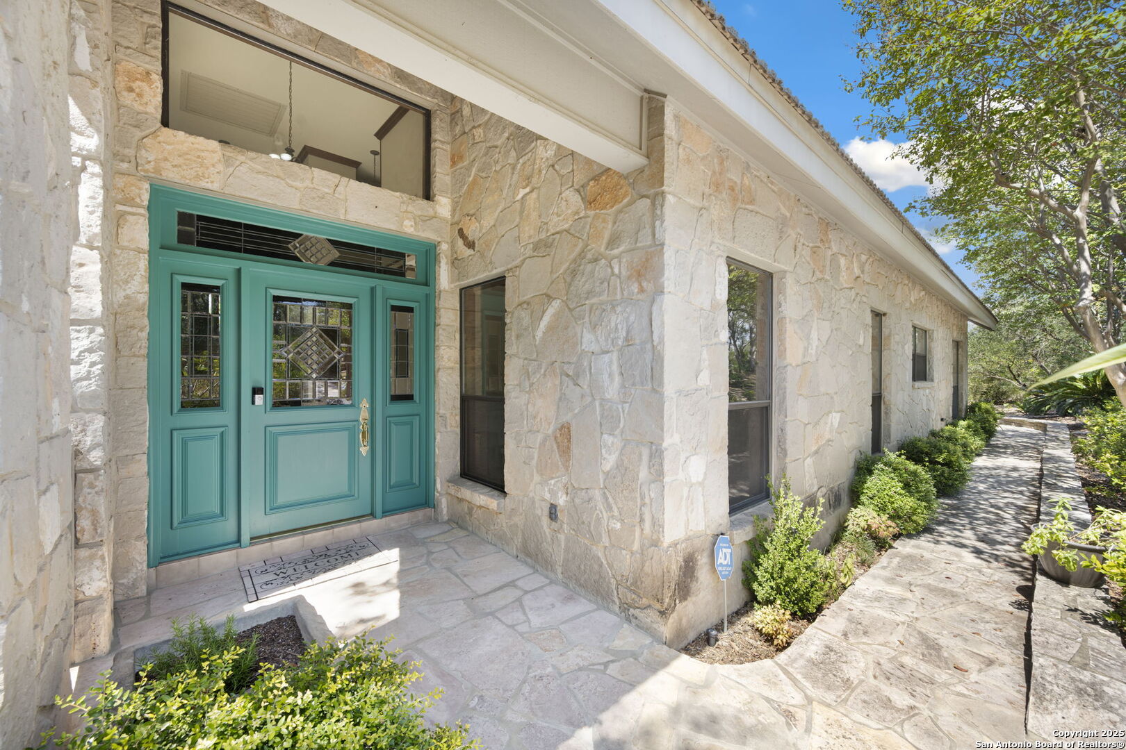 14819 Seven L Trail Helotes, TX 78023 - Photo 40 of 61 a front view of a house with a porch