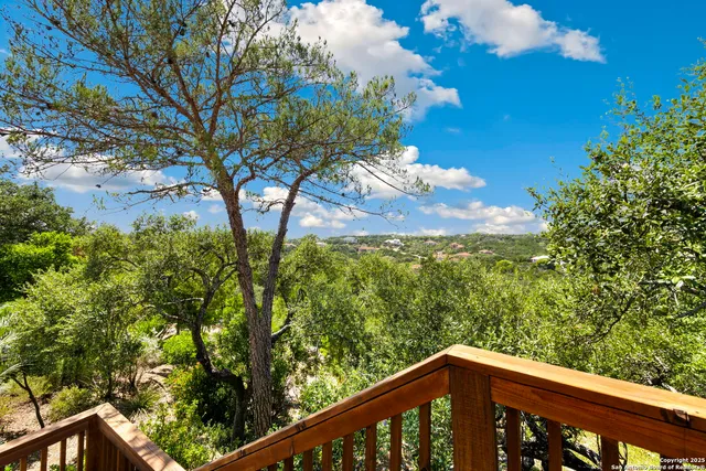 front view of a house with potted plants