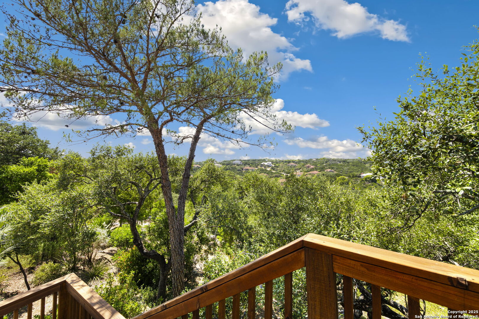 14819 Seven L Trail Helotes, TX 78023 - Photo 4 of 61 a view of a forest from a balcony