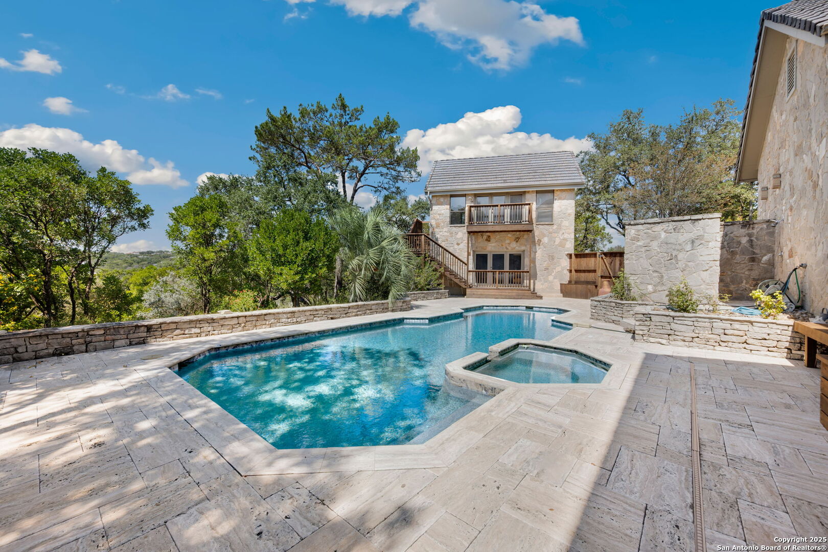 14819 Seven L Trail Helotes, TX 78023 - Photo 50 of 61 a view of a swimming pool with a patio