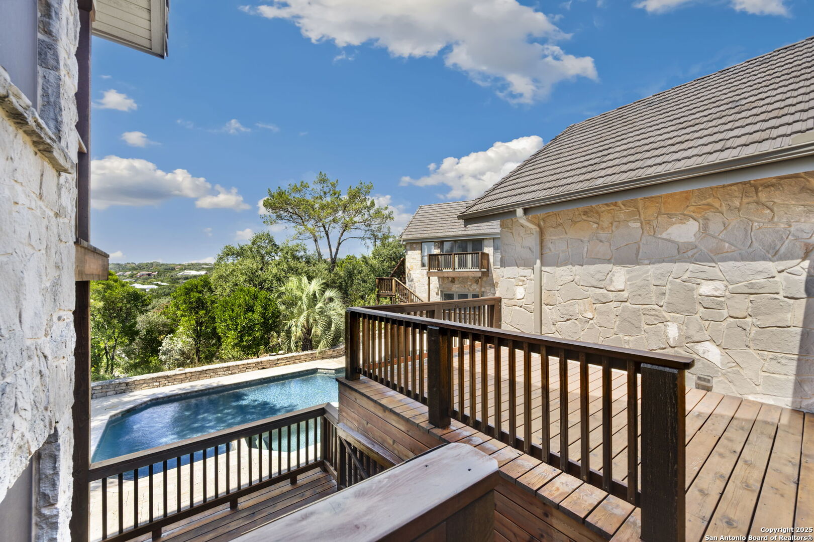 14819 Seven L Trail Helotes, TX 78023 - Photo 52 of 61 a view of a balcony with wooden floor