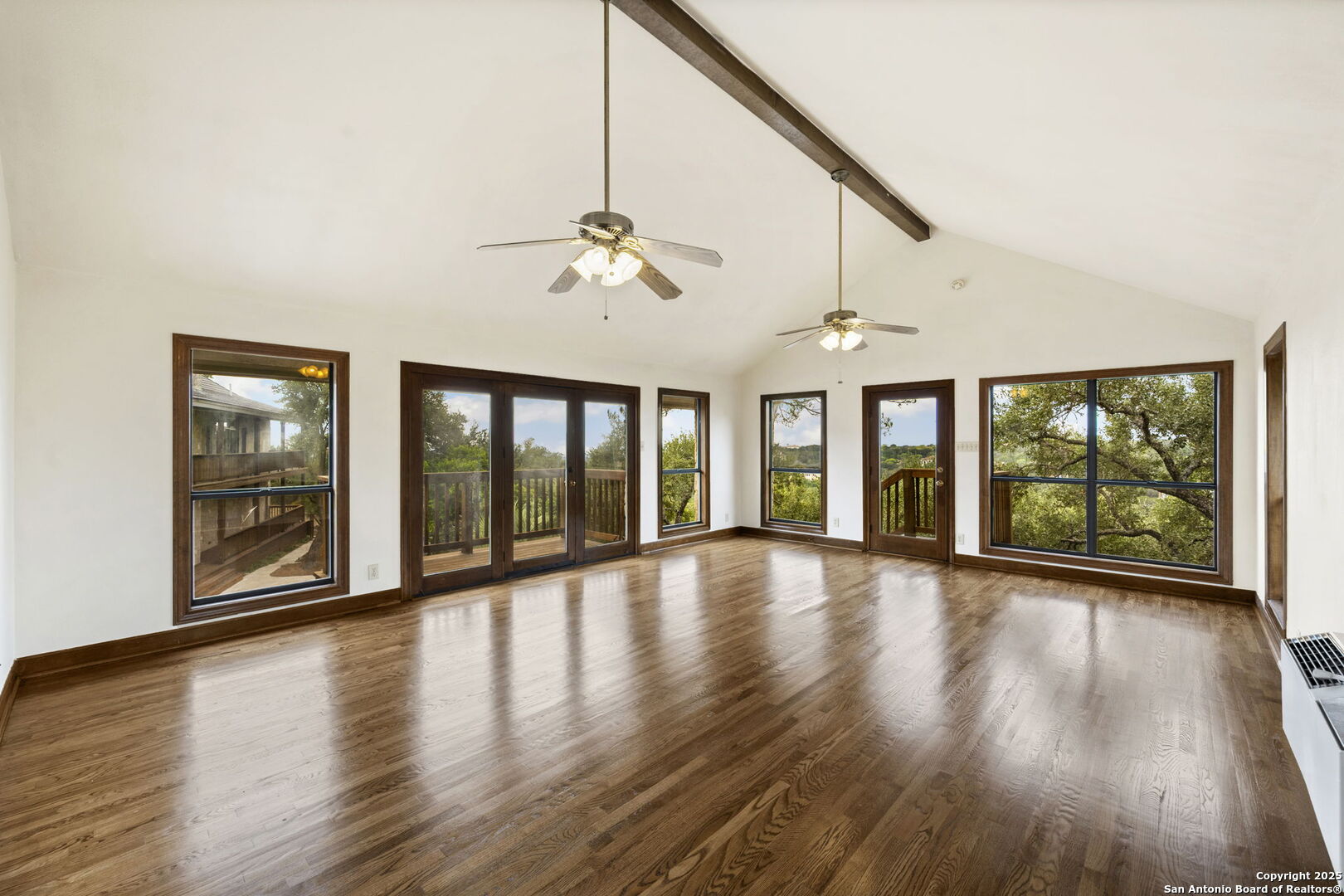 14819 Seven L Trail Helotes, TX 78023 - Photo 53 of 61 a view of an room with wooden floor fan and windows