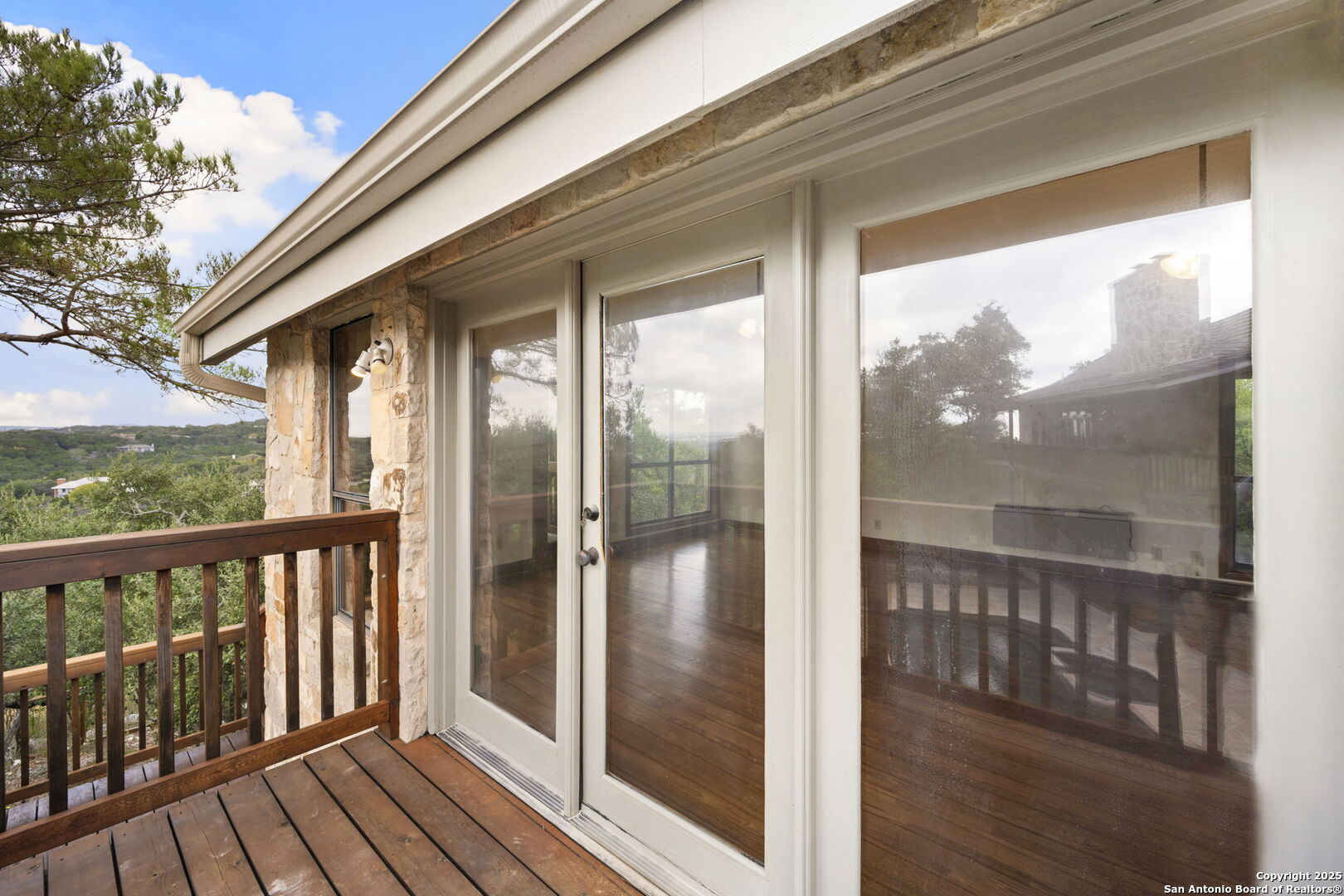 14819 Seven L Trail Helotes, TX 78023 - Photo 54 of 61 a view of a balcony with wooden floor