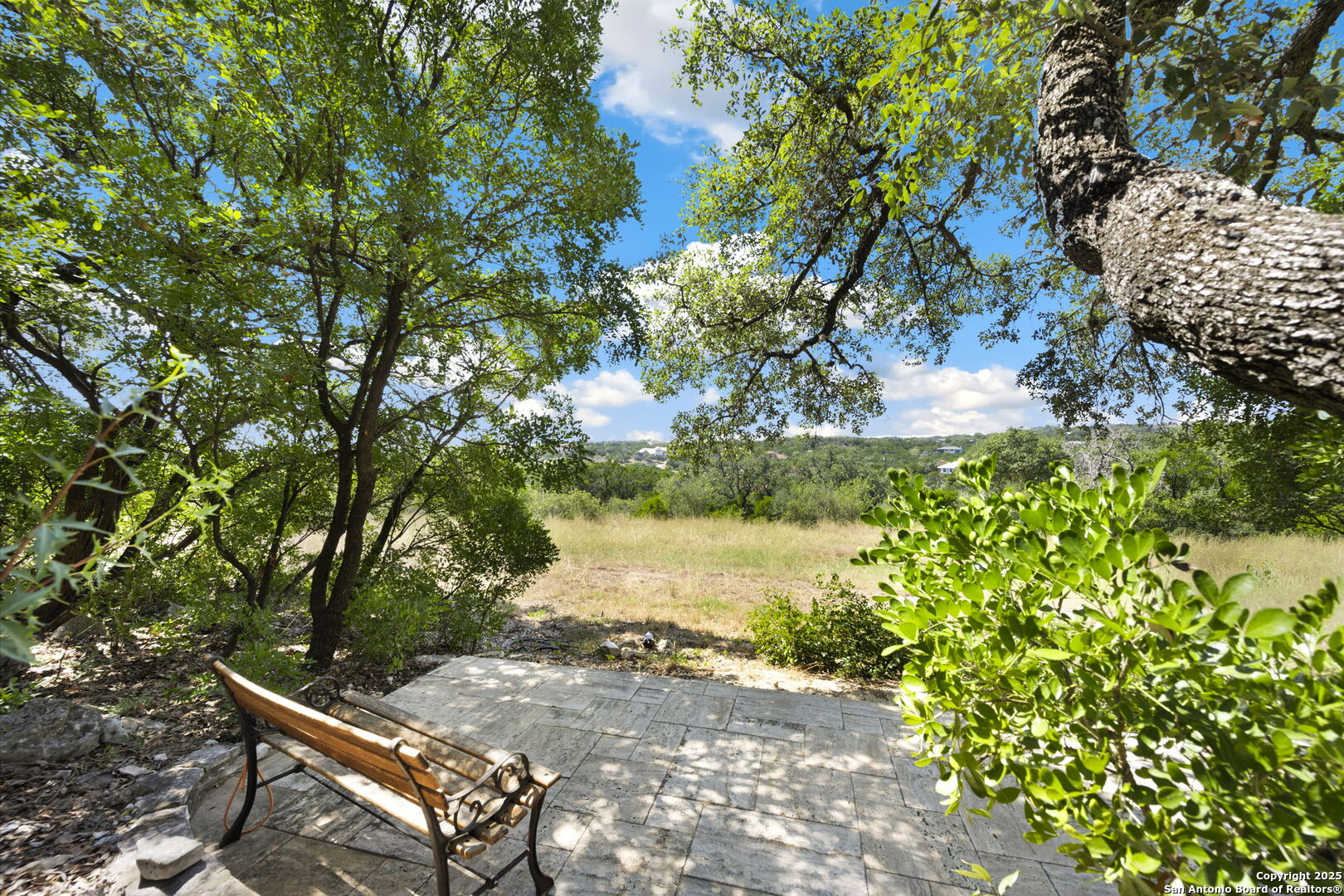 14819 Seven L Trail Helotes, TX 78023 - Photo 56 of 61 a backyard of a house with a yard and outdoor seating