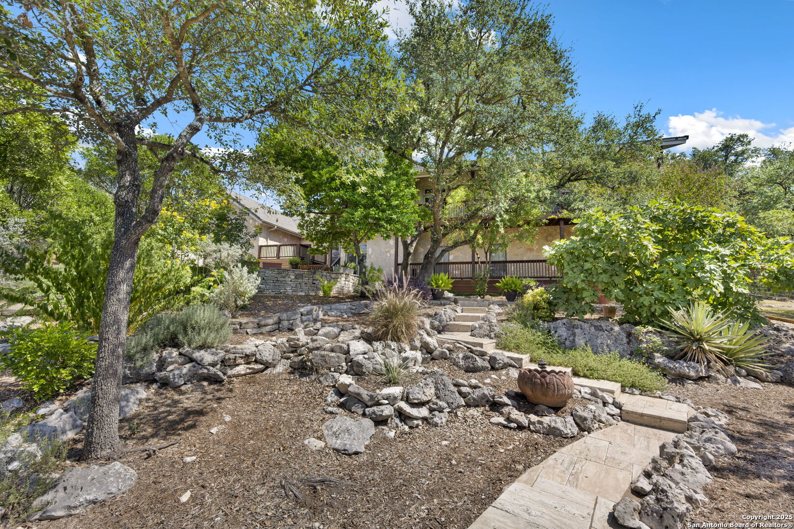 14819 Seven L Trail Helotes, TX 78023 - Photo 60 of 61 a view of a yard with plants and trees