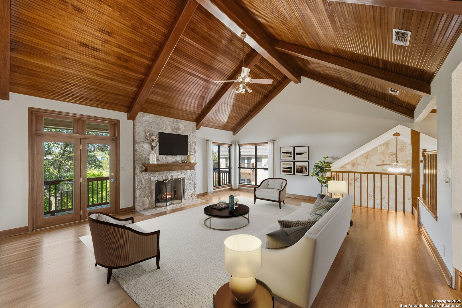 14819 Seven L Trail Helotes, TX 78023 - Photo 6 of 61 a living room with furniture fireplace and flat screen tv