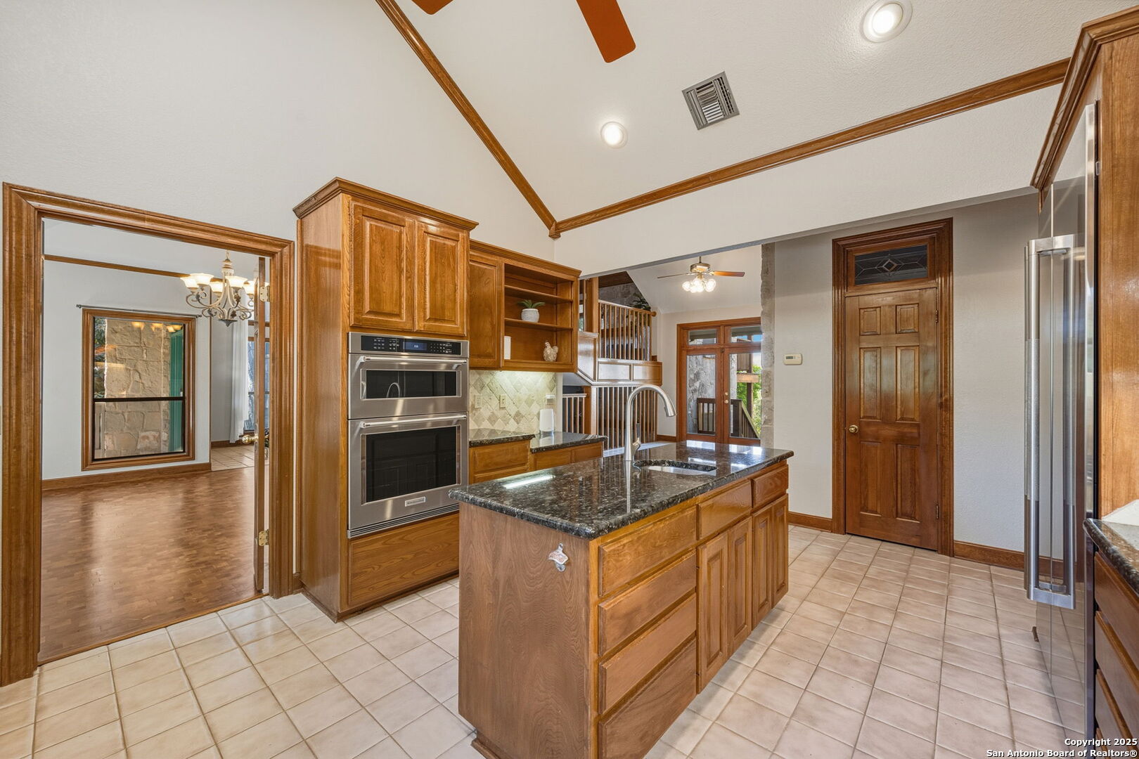 14819 Seven L Trail Helotes, TX 78023 - Photo 9 of 61 a kitchen with stainless steel appliances granite countertop a refrigerator and a stove