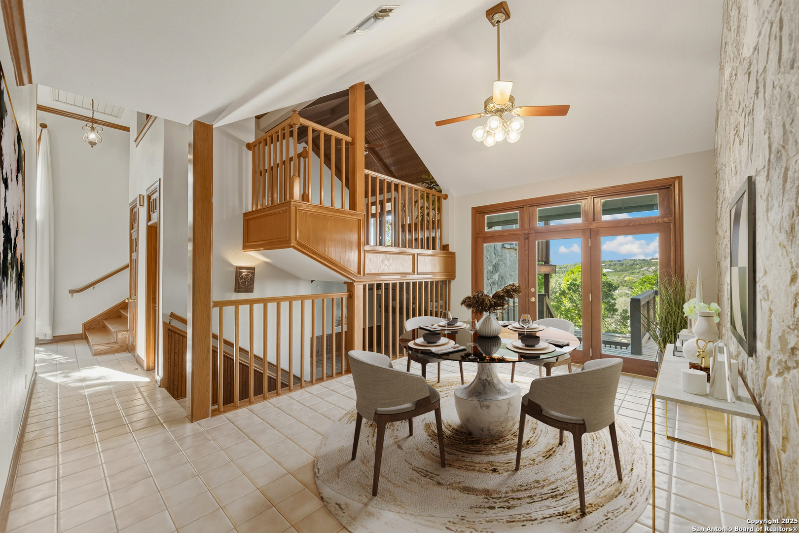14819 Seven L Trail Helotes, TX 78023 - Photo 10 of 61 a dining room with furniture a chandelier and window