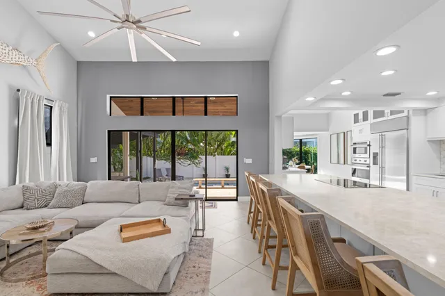 a swimming pool with outdoor seating and yard