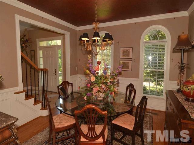 1701 Liatris Lane Raleigh, NC 27613 - Photo 8 of 25 “FLEUR-DE-LIS” WALL PAINT, BEAUTIFUL WAINSCOTING & CHAIR RAIL