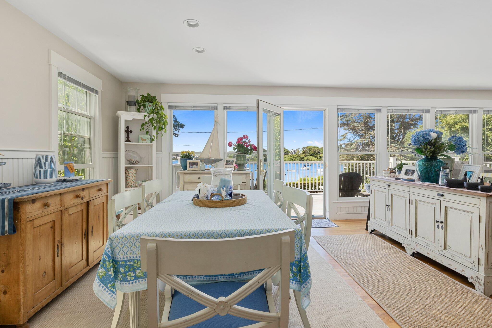 81 Mill Pond Road Chatham, MA 02633 - Photo 12 of 59 a view of a dining room with furniture window and outside view