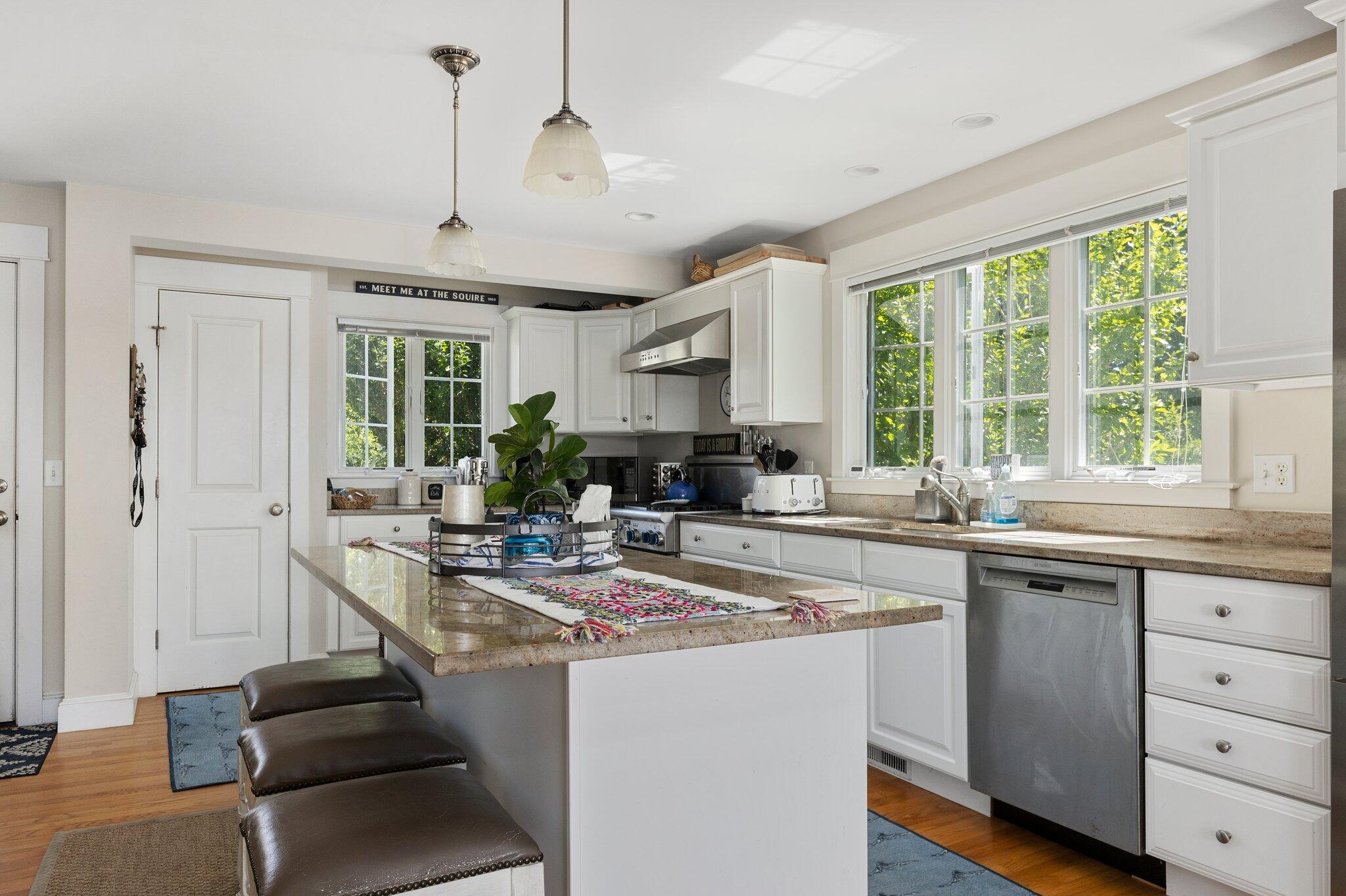 81 Mill Pond Road Chatham, MA 02633 - Photo 14 of 59 a kitchen with stainless steel appliances granite countertop a stove and cabinets