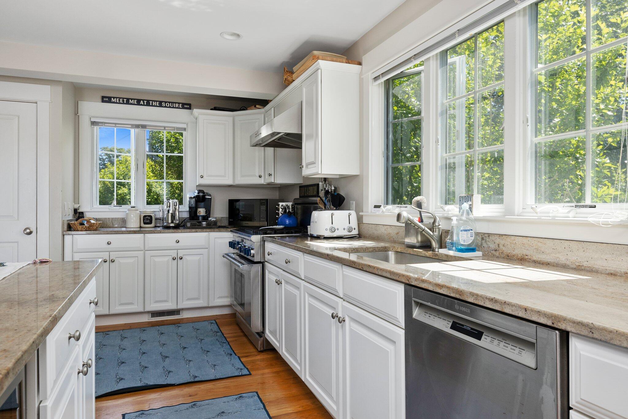 81 Mill Pond Road Chatham, MA 02633 - Photo 15 of 59 a kitchen with a sink stove and cabinets