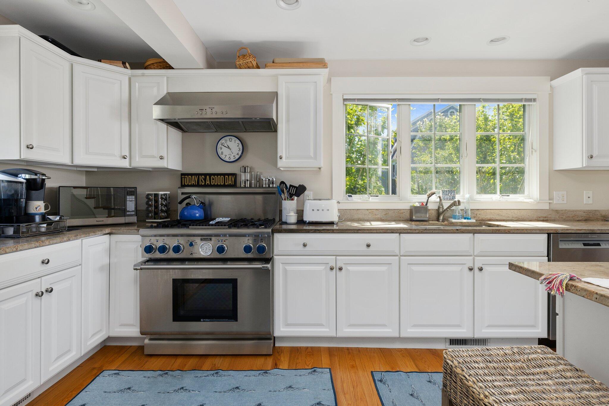 81 Mill Pond Road Chatham, MA 02633 - Photo 16 of 59 a kitchen with granite countertop a stove a sink and a granite counter tops
