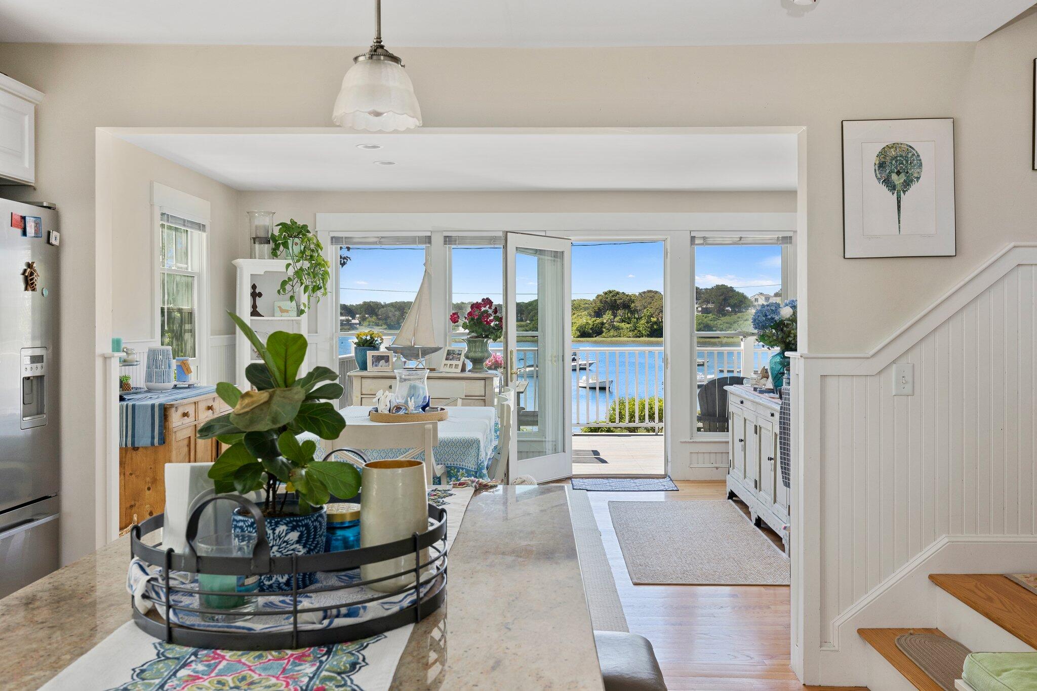 81 Mill Pond Road Chatham, MA 02633 - Photo 17 of 59 a vase of flowers sitting on a table