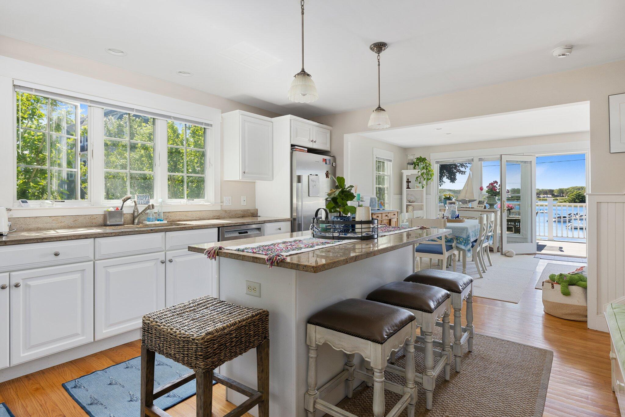 81 Mill Pond Road Chatham, MA 02633 - Photo 19 of 59 a kitchen with sink cabinets and dining table